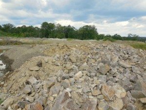 Unexplained rock piles behind WalMart - a Quincy Quarry photo