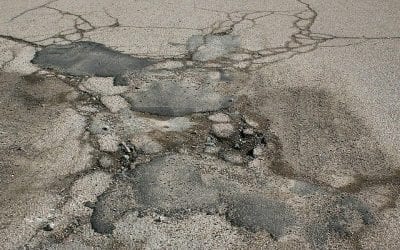 Quincy drivers still suffering potholes all over town