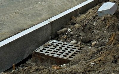Quincy storm drain sideways in sidewalk