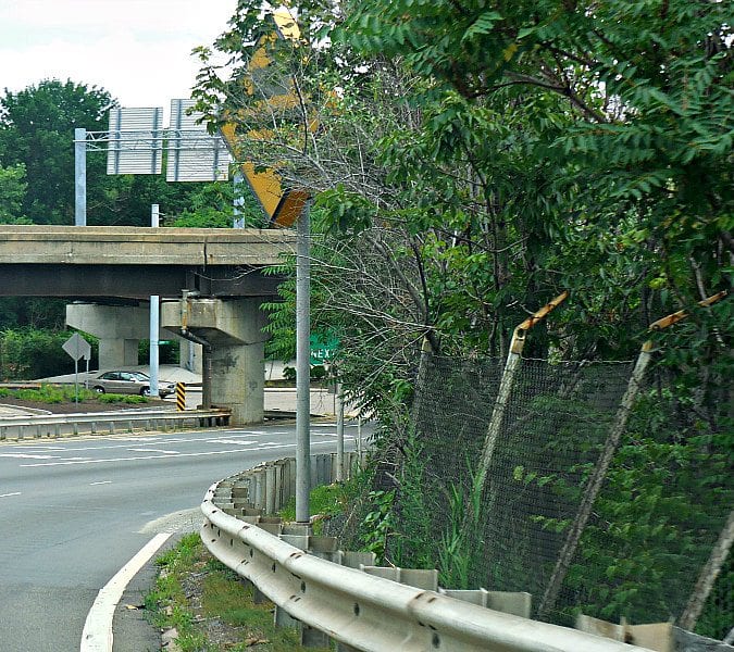 Quincy traffic warning sign dangerously covered and turned sideways