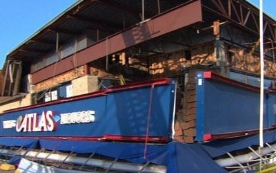 Quincy liquor store facade busted
