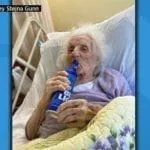 One Hundred and three year old enjoys a beer to celebrate her beating COVID-19 beer