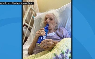 One Hundred and three year old enjoys a beer to celebrate her beating COVID-19
