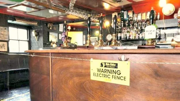 British Pub landlord installs electric fence around bar