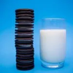 Oreo Cookie Shortage on the Horizon? Chocolate cookies are depicted with a glass of milk.