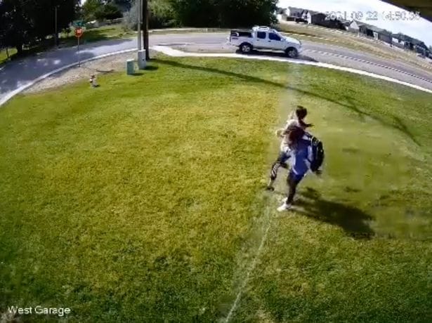 Man divides opinion by setting off a sprinkler on people who step on his lawn
