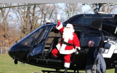 Santa Claus flies to rather than parachutes onto Pagaent Field this year