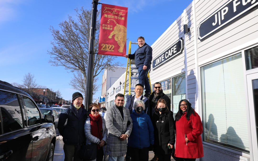 Quincy Mayor Thomas P. Koch relies on a lift for a photo op!